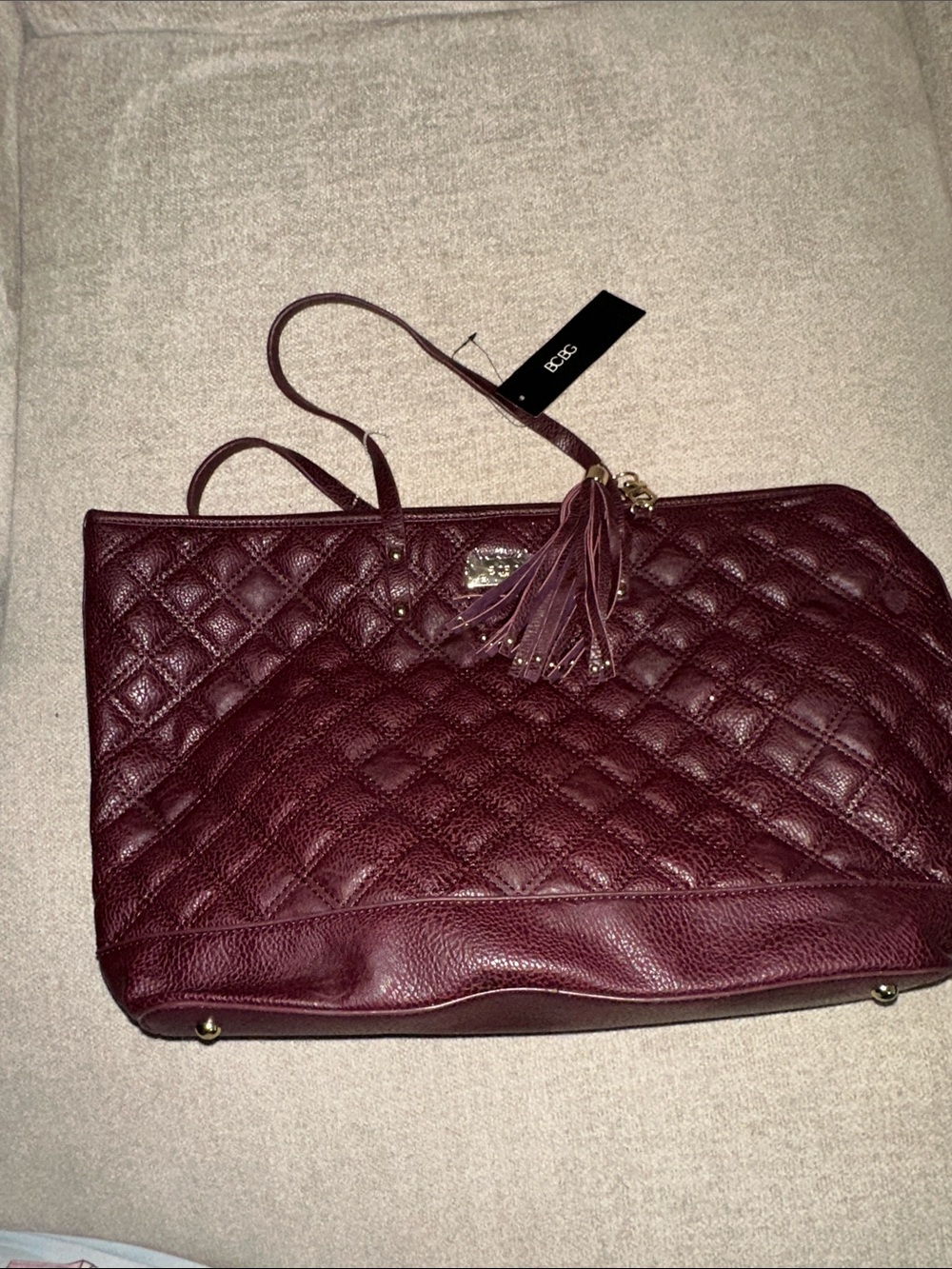 BCBG Quilted Tote Bag in Burgundy with Tassel Accent